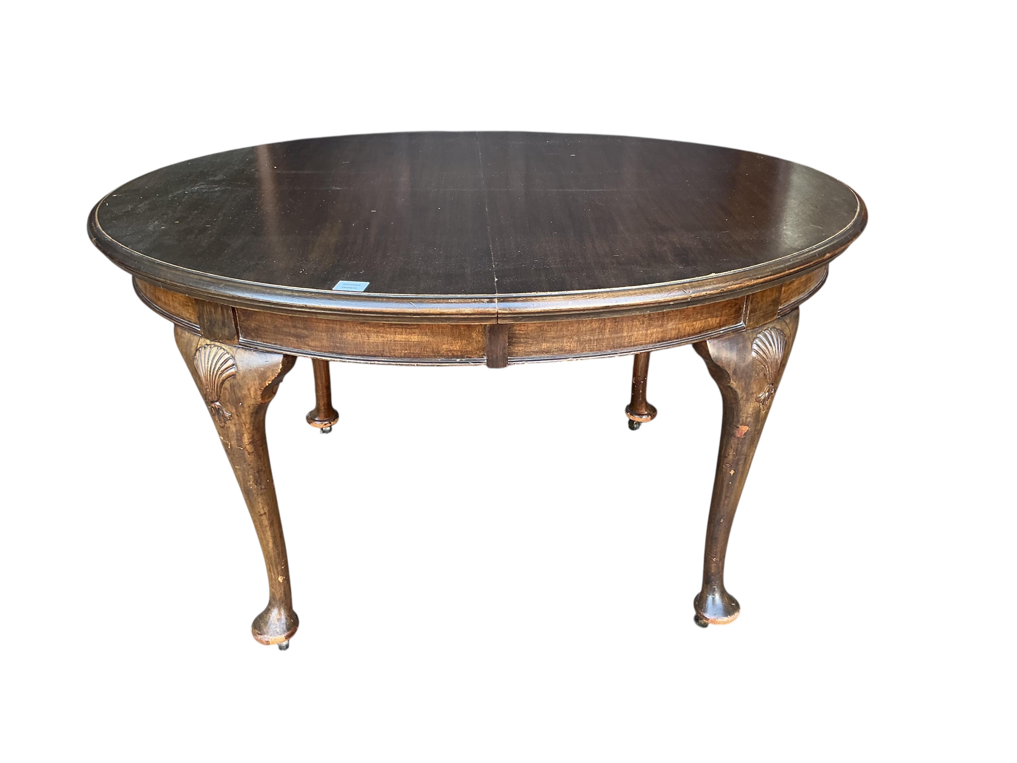 A Chippendale Revival mahogany extending dining table, 210cm extended, two spare leaves, depth 106cm, height 74cm together with a set of six Chippendale Revival mahogany dining chairs, two with arms